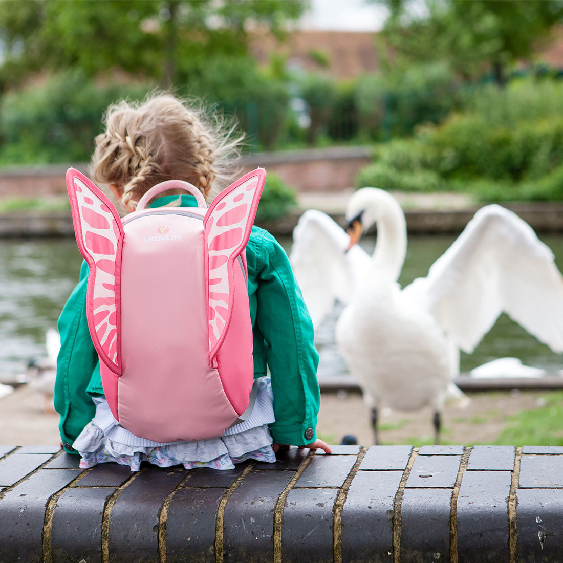 Little kid with outlet big backpack